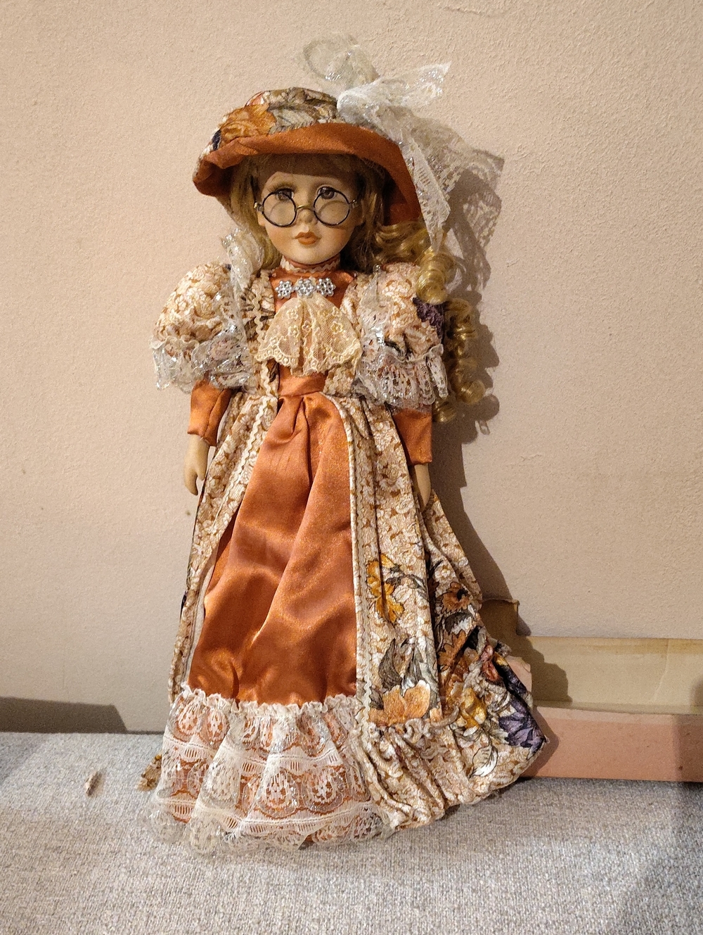 Collectible Porcelain Doll in Orange Dress with Lace Hat